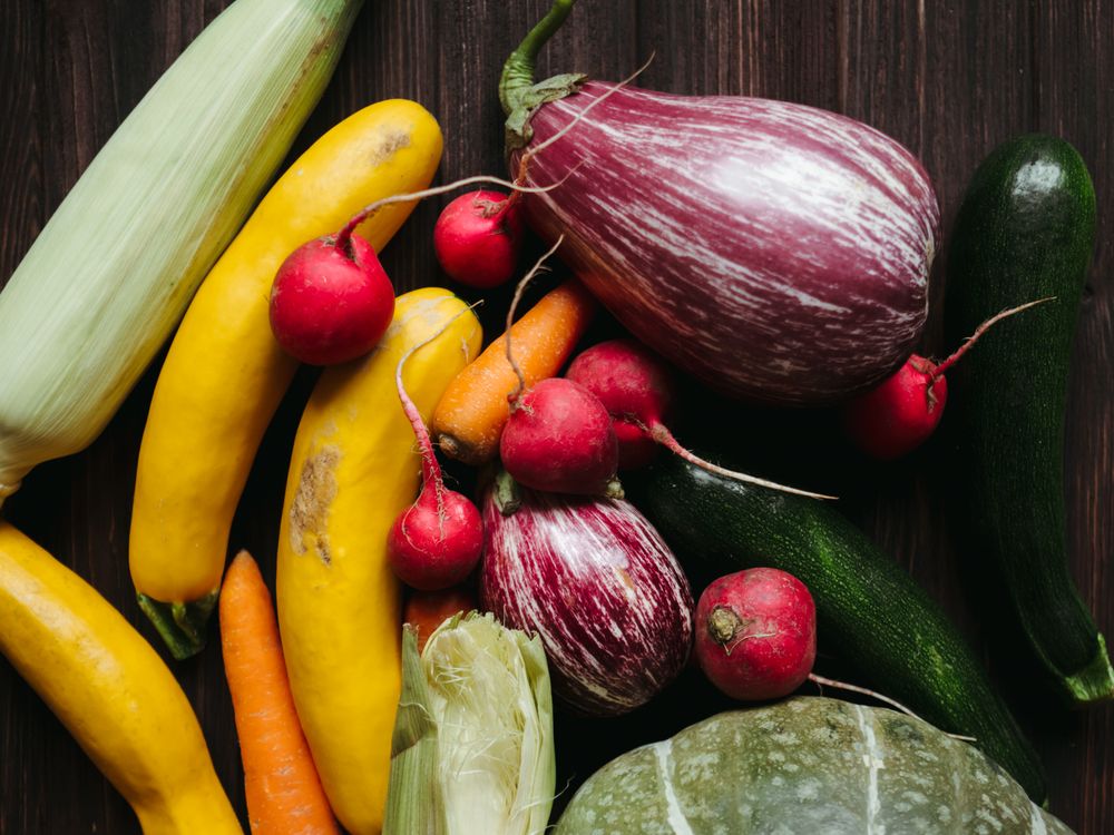 A vibrant spread of fresh vegetables on a wooden table